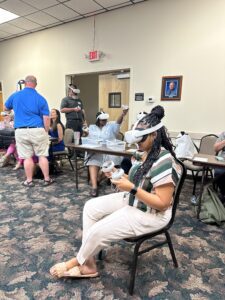 people with VR headsets on sitting in chairs 